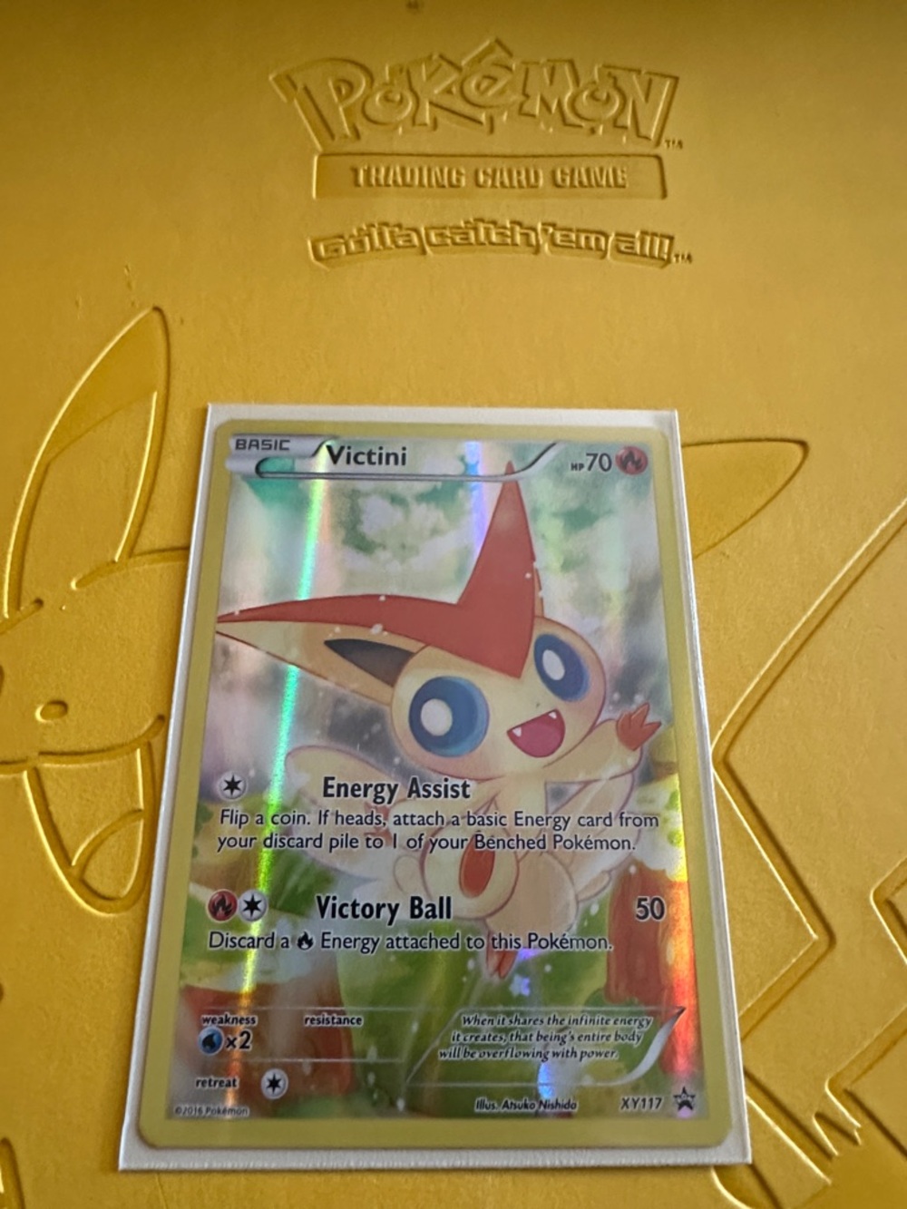 Pokémon Victini Holographic Card - Yellow/Red